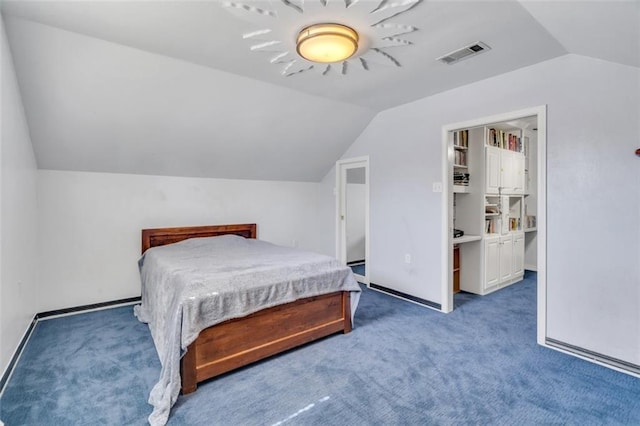 carpeted bedroom featuring vaulted ceiling