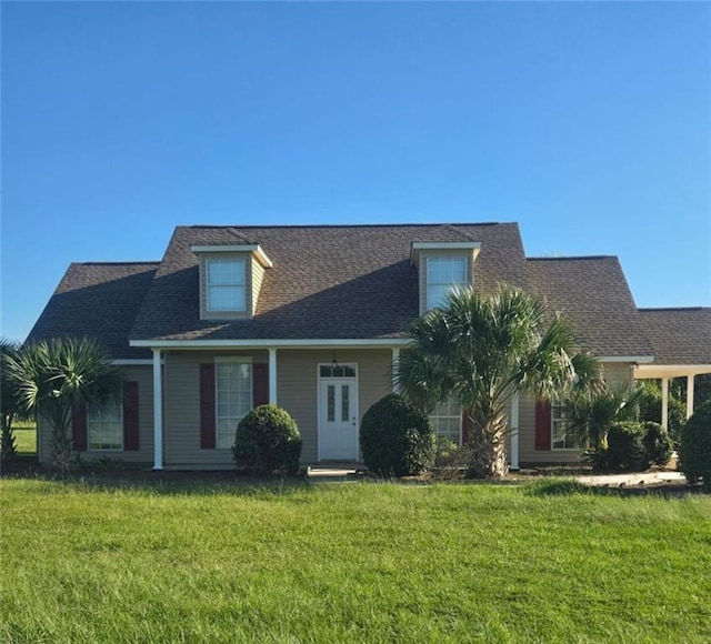 view of front of property with a front lawn