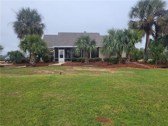 single story home with a front lawn and a sunroom