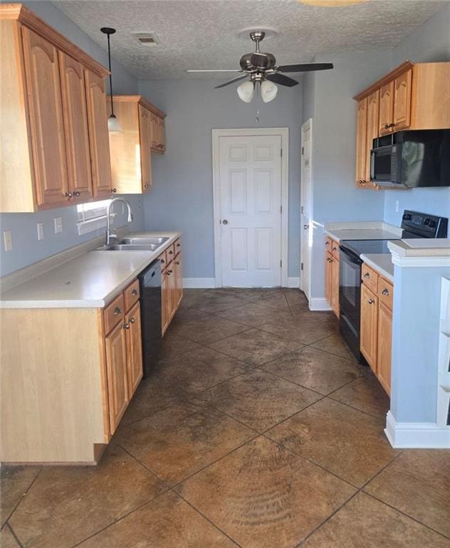 kitchen with hanging light fixtures, a textured ceiling, black appliances, ceiling fan, and sink