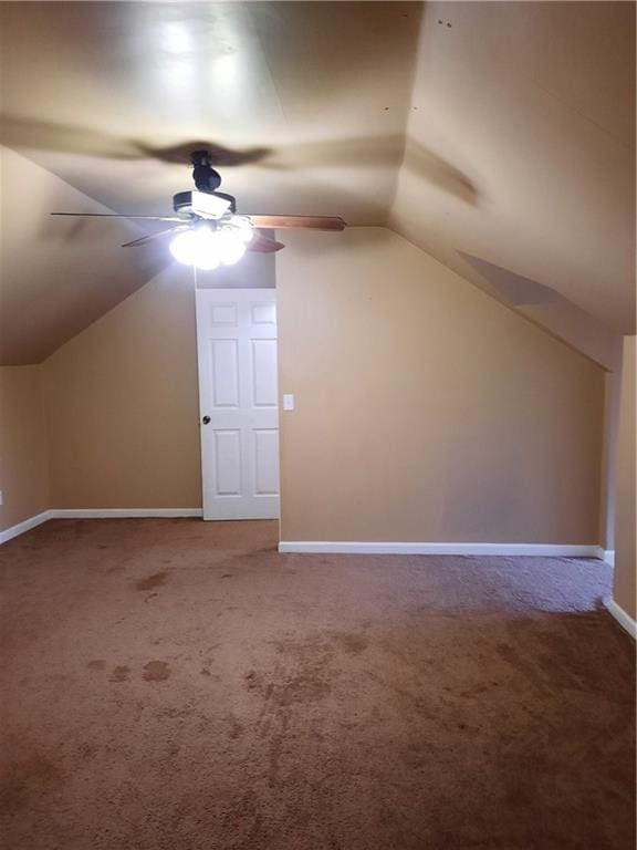 bonus room featuring carpet, lofted ceiling, and ceiling fan