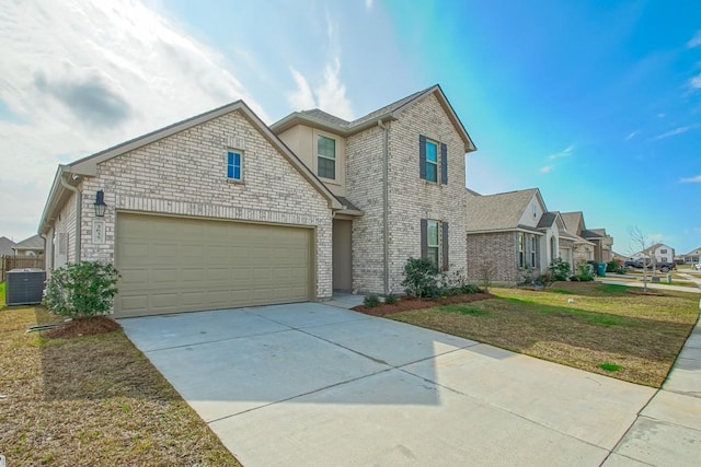 traditional-style home featuring cooling unit, a garage, driveway, a residential view, and a front lawn