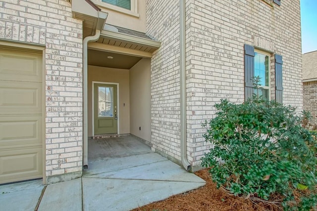 doorway to property featuring a garage