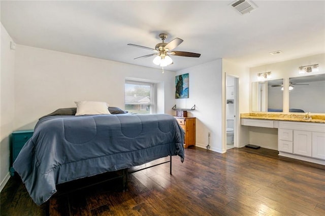 bedroom featuring ensuite bathroom, ceiling fan, and dark hardwood / wood-style floors