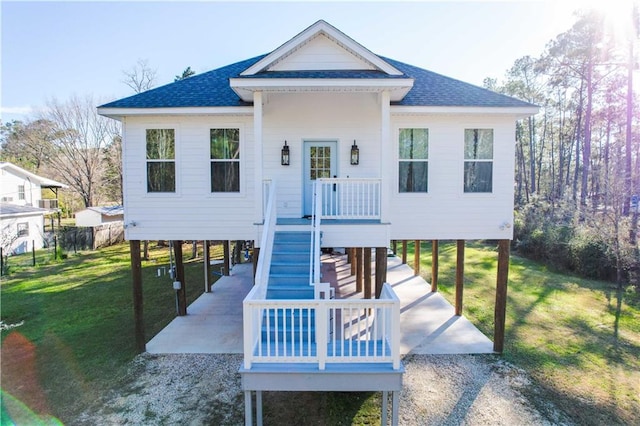 exterior space featuring a front lawn and a carport