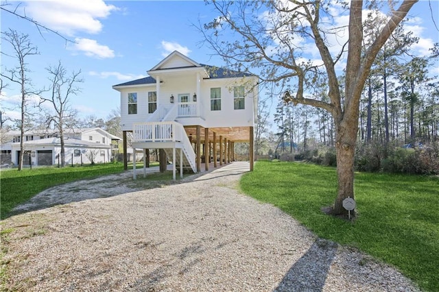 rear view of property with a yard