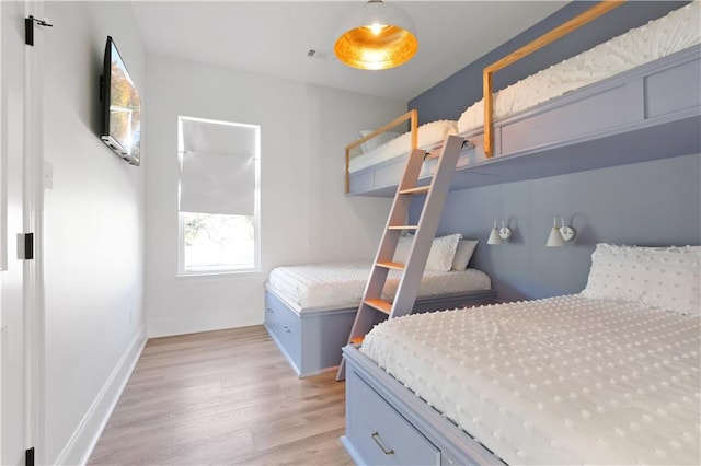 bedroom with light wood-type flooring