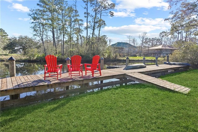 view of dock with a yard