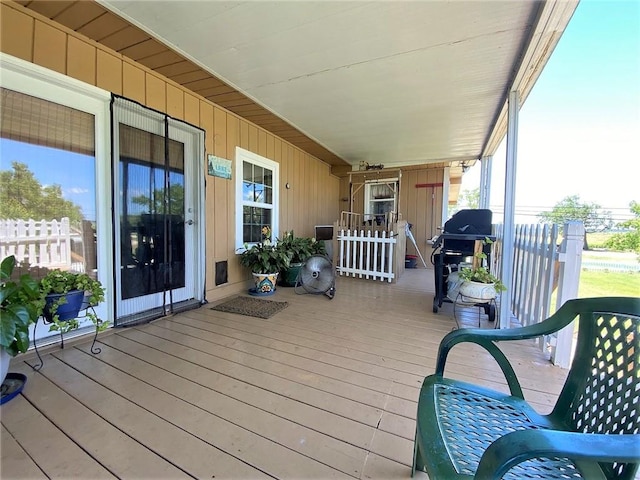 wooden terrace with area for grilling