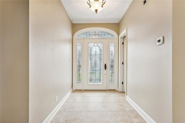 tiled foyer entrance featuring plenty of natural light and crown molding