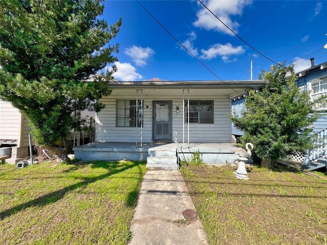 bungalow-style home featuring a front lawn