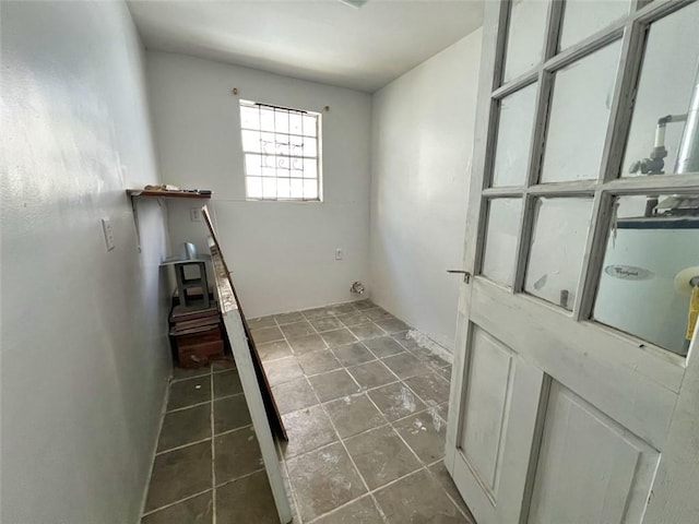 laundry room with tile floors