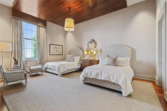 bedroom featuring wooden ceiling and wood-type flooring