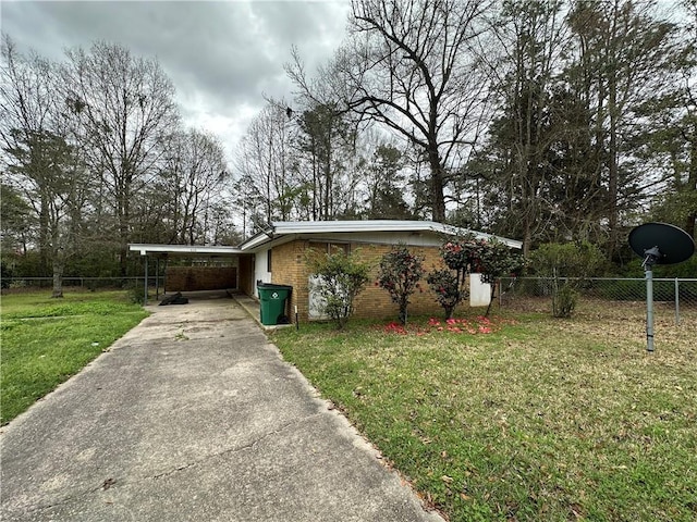 ranch-style house with a front lawn and a carport