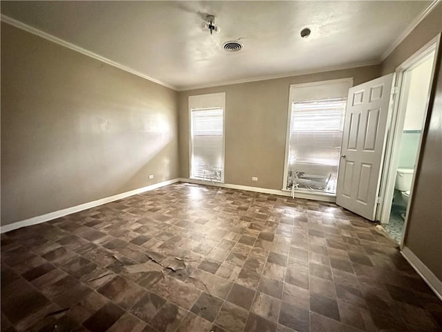 tiled spare room featuring ornamental molding