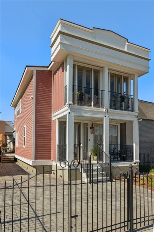 view of front of house featuring a balcony