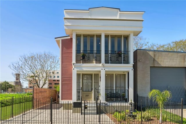 view of front of house featuring a balcony