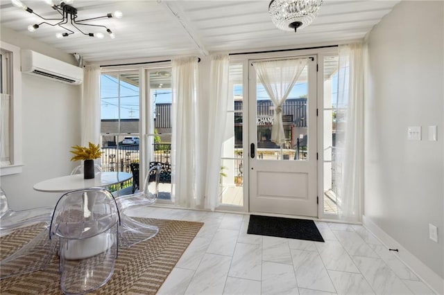 entryway featuring an inviting chandelier, a wall unit AC, and light tile flooring