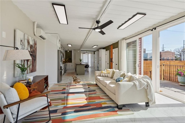 sunroom / solarium featuring ceiling fan and a wall mounted air conditioner