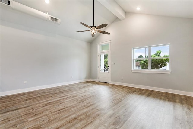 empty room with high vaulted ceiling, hardwood / wood-style floors, ceiling fan, and beam ceiling