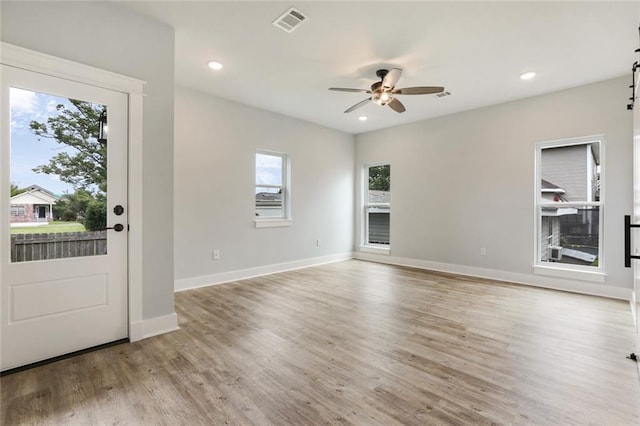 interior space with light hardwood / wood-style flooring and ceiling fan