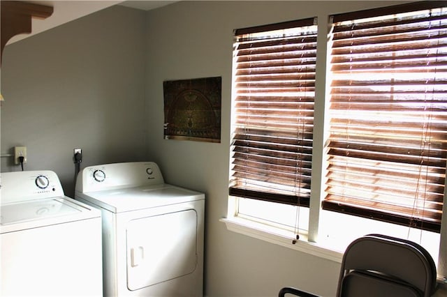 clothes washing area featuring washer and dryer