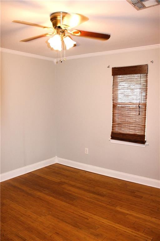 unfurnished room featuring ceiling fan, dark hardwood / wood-style flooring, and ornamental molding