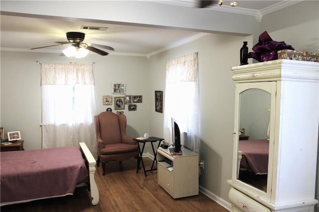 bedroom featuring ceiling fan, dark hardwood / wood-style floors, and ornamental molding