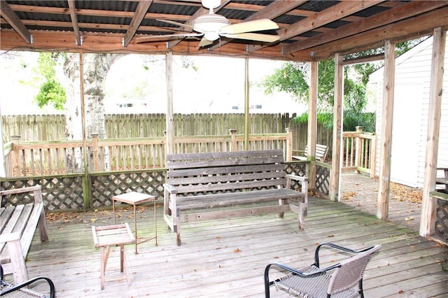 sunroom / solarium featuring ceiling fan