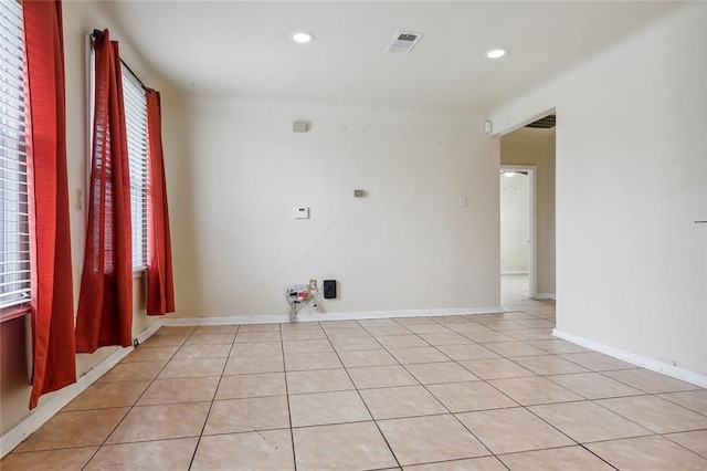 empty room with recessed lighting, visible vents, baseboards, and light tile patterned flooring