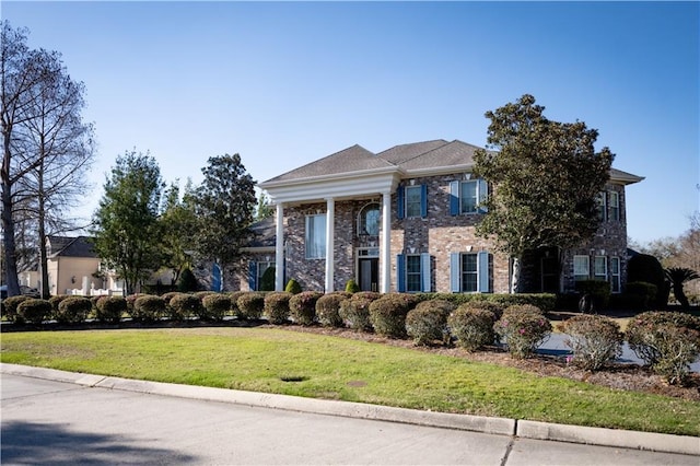 view of front of property with a front lawn