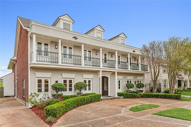 view of front of home with a balcony