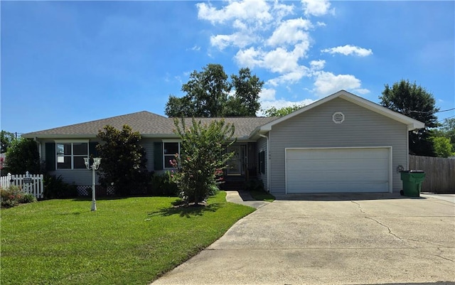 ranch-style home with a garage and a front lawn