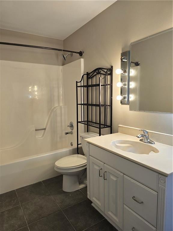 full bathroom featuring tile patterned floors, vanity, toilet, and tub / shower combination