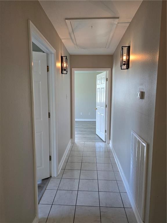 hallway featuring light tile patterned floors