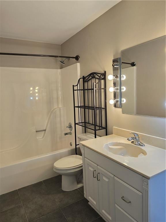 full bathroom with tile patterned floors, toilet, shower / bath combination, and vanity