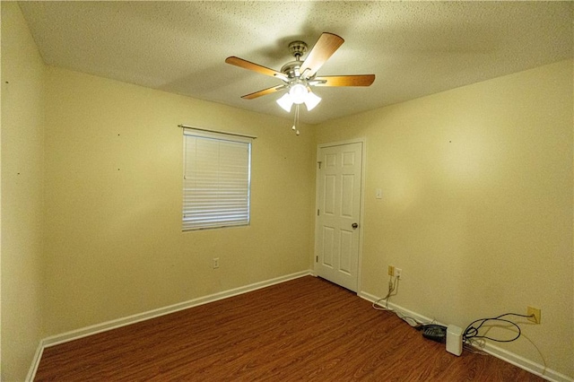 empty room featuring a textured ceiling, ceiling fan, and hardwood / wood-style floors