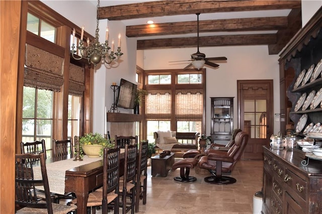 dining room featuring beam ceiling, light tile flooring, ceiling fan with notable chandelier, and a wealth of natural light