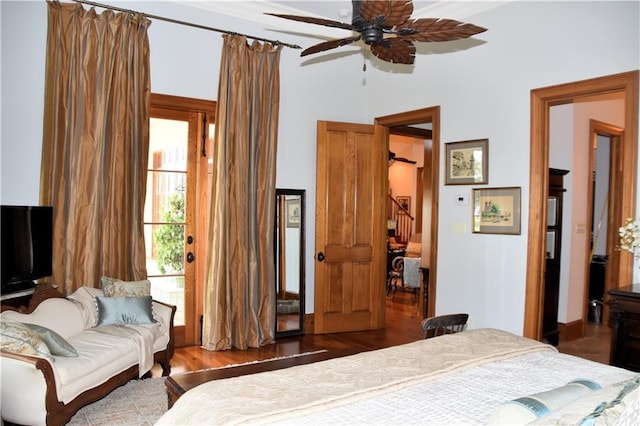 bedroom with ceiling fan and dark hardwood / wood-style floors