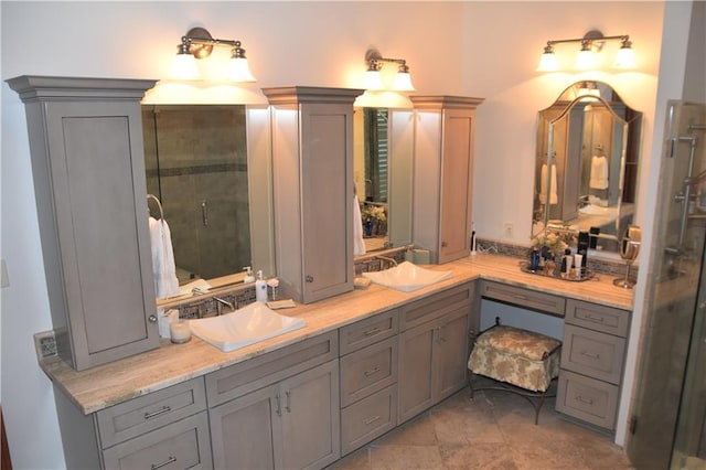 bathroom with vanity, tile floors, and walk in shower