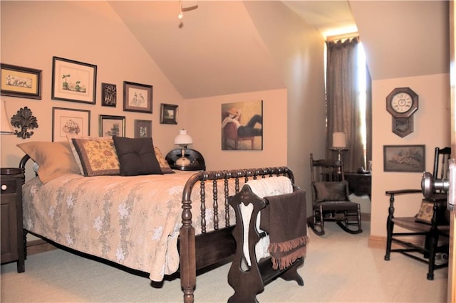 bedroom featuring light colored carpet and lofted ceiling