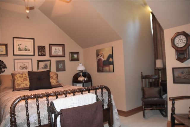 bedroom featuring lofted ceiling and light carpet