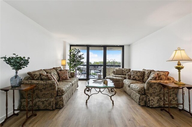 living room featuring hardwood / wood-style floors and expansive windows