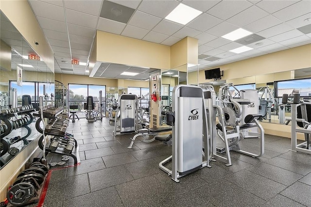 workout area with a paneled ceiling