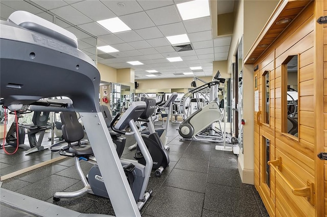 workout area with a paneled ceiling and visible vents