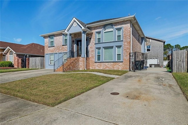 view of front of home featuring a front lawn and a garage