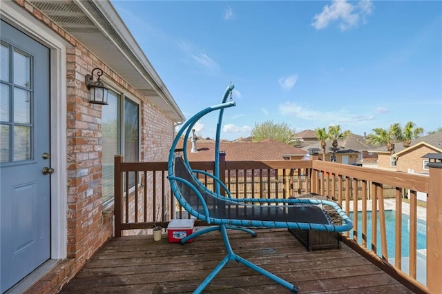 wooden balcony featuring a deck