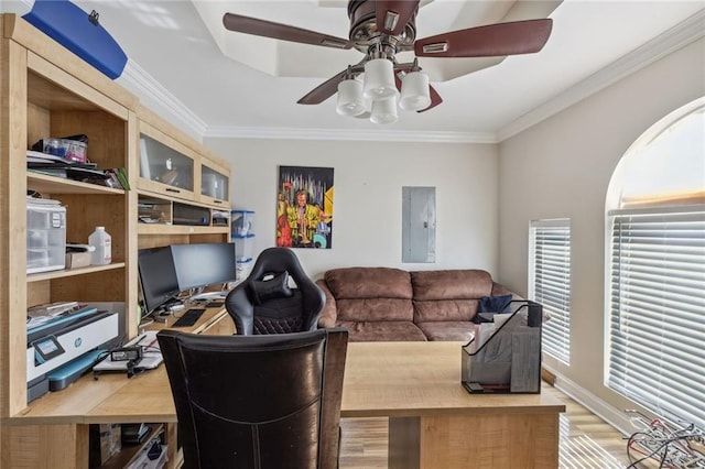 home office featuring ornamental molding, wood-type flooring, and ceiling fan