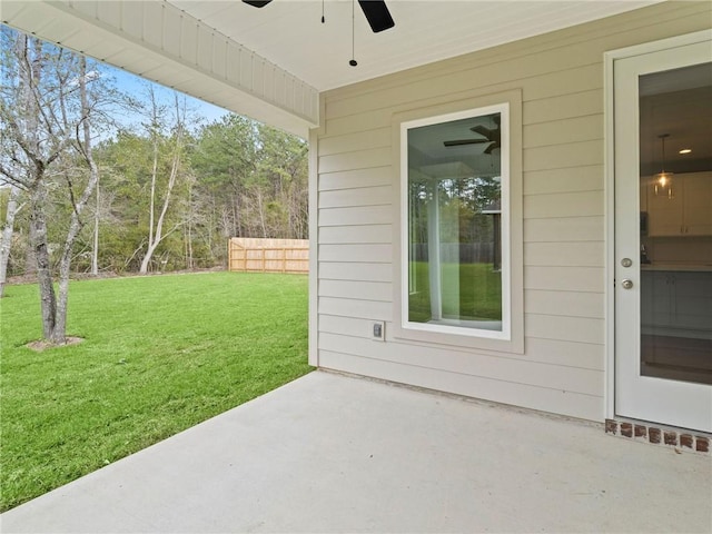 view of patio featuring ceiling fan