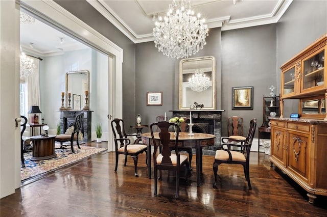 dining space featuring an inviting chandelier, dark hardwood / wood-style flooring, and ornamental molding